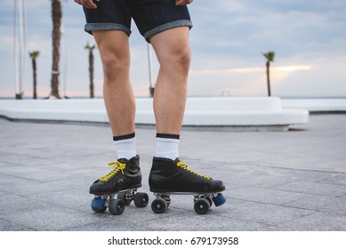 Young Caucasian Man Roller Skating With Quad Skates Near The Sea, Close Up