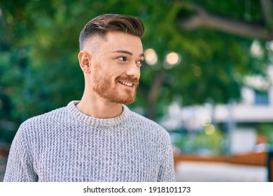 Young Caucasian Man Smiling Happy Standing At The Park.