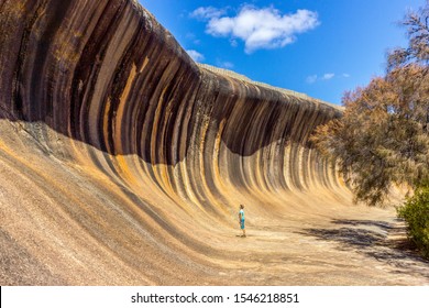 young caucasian man standing at Wave Rock. Wave Rock, Hyden, Western Australia