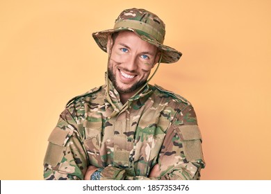 Young Caucasian Man Wearing Camouflage Army Uniform Happy Face Smiling With Crossed Arms Looking At The Camera. Positive Person. 