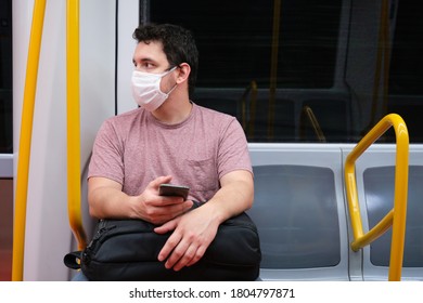 Young caucasian man wearing mask in the Madrid underground. Madrid underground, new normality. - Powered by Shutterstock