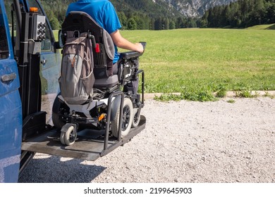 Young Caucasian man in a wheelchair using the vertical platform lift to get in the van parked in the nature - Powered by Shutterstock