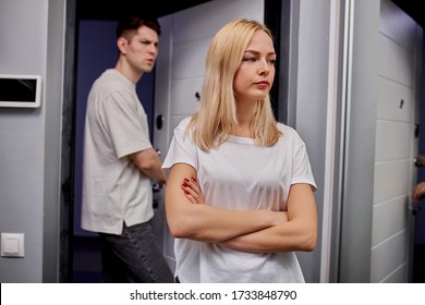 Young Caucasian Married Couple Argue, Swear In Doorstep. Man Tired Of Family Life With Wife. Crisis In Family, Misunderstanding Concept