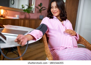 Young Caucasian Measure Pressure At Home, Pregnant Woman Use Digital Blood Pressure Monitor, Antenatal Medical Care Alone