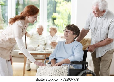 Young Caucasian Nurse Saying Goodbye To Her Patient Leaving Sanatorium