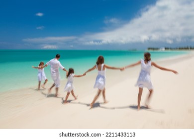 Young Caucasian Parents And Children Having Fun On Beach Vacation Togetherness In Tropical Caribbean Summer Resort For Leisure Travel Escape