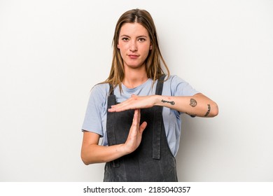 Young caucasian pregnant woman isolated on white background showing a timeout gesture. - Powered by Shutterstock