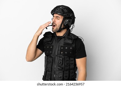 Young Caucasian Swat Isolated On White Background Yawning And Covering Wide Open Mouth With Hand