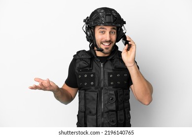 Young Caucasian Swat Isolated On White Background Keeping A Conversation With The Mobile Phone With Someone