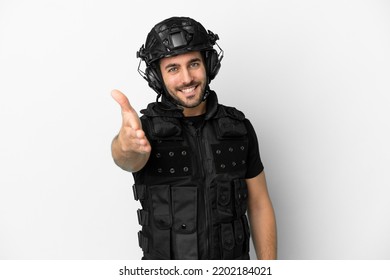 Young Caucasian Swat Isolated On White Background Shaking Hands For Closing A Good Deal