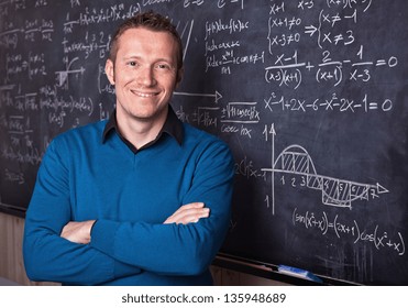 Young Caucasian Teacher Portrait With Blackboard Background