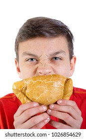 Young Caucasian Teenage Boy Eating A Cornish Pasty