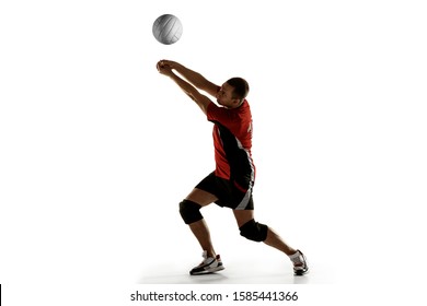 Young caucasian volleyball player placticing isolated on white background. Male sportsman training with the ball in motion and action. Sport, healthy lifestyle, activity, movement concept. Copyspace. - Shutterstock ID 1585441366