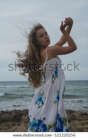 Similar – Young woman on the beach in the sun