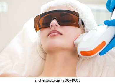 Young Caucasian Winsome Woman Getting IPL Laser and Ultrasound Facial Treatment in Modern Medical Spa Center As Skin Rejuvenation.Horizontal image - Shutterstock ID 2195719355