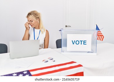 Young Caucasian Woman At America Political Campaign Election Tired Rubbing Nose And Eyes Feeling Fatigue And Headache. Stress And Frustration Concept. 