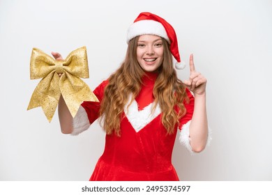 Young caucasian woman with Christmas dress holding Christmas bow isolated on white background pointing up a great idea - Powered by Shutterstock