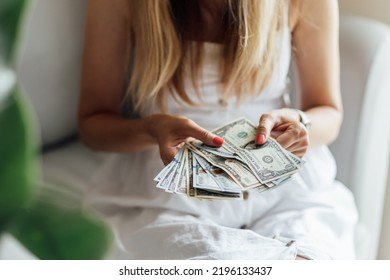 Young Caucasian Woman Counting Cash Money Dollar Bills At Home. Investment Business, Retirement, Finance And Saving Money For Future Concept.