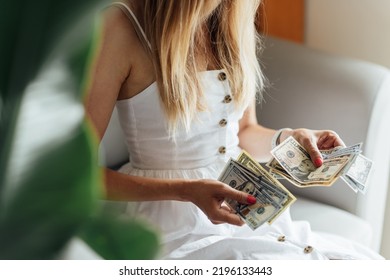 Young Caucasian Woman Counting Cash Money Dollar Bills At Home. Investment Business, Retirement, Finance And Saving Money For Future Concept.