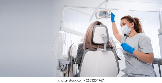 young caucasian woman dentist and patient. Dentist lifestyle scene. Doctoral practice. Patient healthcare. Banner. copy space. - Powered by Shutterstock