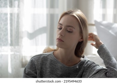 Young caucasian woman is depression and having mental problem in the bedroom at home, emotion and negative, woman loneliness and worry with disappoint, expression and hopelessness, lifestyles concept. - Shutterstock ID 2195494633