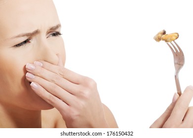 Young Caucasian Woman Eating Seafood With Disguise. Isolated On White.