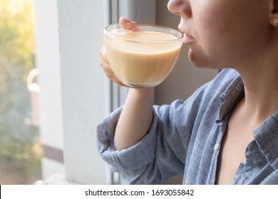 Young Caucasian Woman Enjoying A Cup Of Milk Tea Masala In The Morning