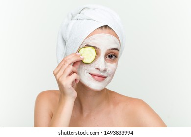 Young Caucasian Woman Enjoying Of A Facial Mask Treatment With Cucumber