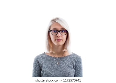 Young Caucasian Woman With Glasses Looking Away Isolated On White Background. No Emotion, Neutral Poker Face