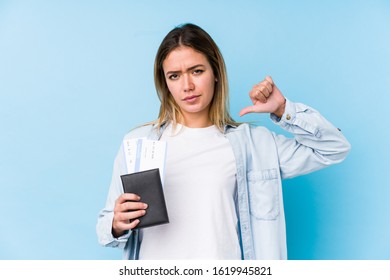 Young Caucasian Woman Holding A Passport Isolated Feels Proud And Self Confident, Example To Follow.