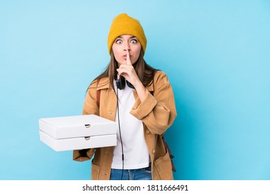 Young Caucasian Woman Holding Pizzas Isolated Keeping A Secret Or Asking For Silence.