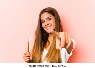 Young Caucasian Woman Holding A Toothbrush Cheerful Smiles Pointing To Front.