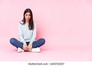 Young Caucasian Woman Isolated On Pink Background With Sad And Depressed Expression