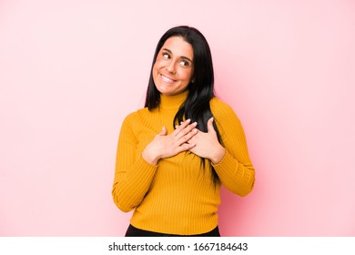 Young caucasian woman isolated on a pink background has friendly expression, pressing palm to chest. Love concept. - Shutterstock ID 1667184643