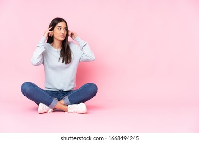 Young Caucasian Woman Isolated On Pink Background Having Doubts And Thinking