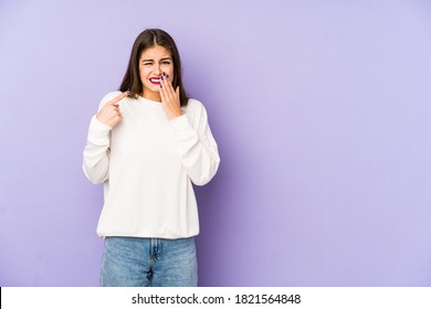 Young Caucasian Woman Isolated On Purple Background Having A Strong Teeth Pain, Molar Ache.