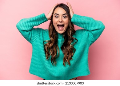 Young Caucasian Woman Isolated On Pink Background Screaming, Very Excited, Passionate, Satisfied With Something.