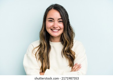 Young Caucasian Woman Isolated On Blue Background Who Feels Confident, Crossing Arms With Determination.