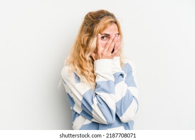 Young Caucasian Woman Isolated On White Background Blink Through Fingers Frightened And Nervous.