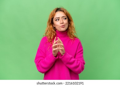 Young caucasian woman isolated on green screen chroma key background scheming something - Powered by Shutterstock