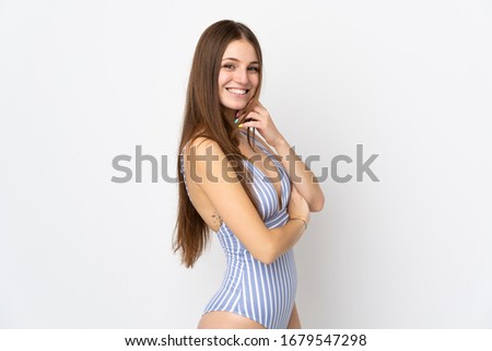 Young caucasian woman isolated on white background in swimsuit in summer holidays