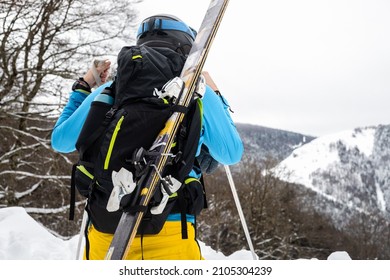 Young Caucasian Woman Looking A Winter Landscape After A Heavy Snow Storm On The Pyrenees.