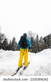 Young Caucasian Woman Looking A Winter Landscape After A Heavy Snow Storm On The Pyrenees.