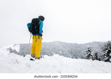 Young Caucasian Woman Looking A Winter Landscape After A Heavy Snow Storm On The Pyrenees.