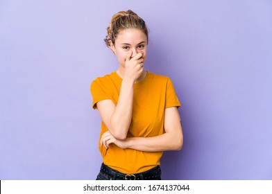 Young caucasian woman on purple background laughing happy, carefree, natural emotion. - Shutterstock ID 1674137044