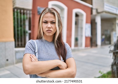 Young Caucasian Woman Outdoors Skeptic And Nervous, Disapproving Expression On Face With Crossed Arms. Negative Person. 