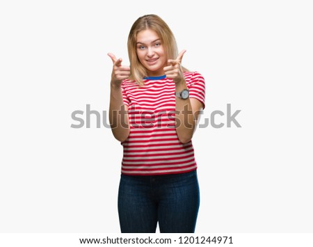 Young caucasian woman over isolated background pointing fingers to camera with happy and funny face. Good energy and vibes.
