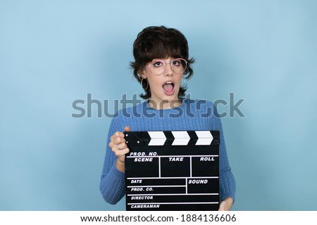 Similar – Image, Stock Photo Cheerful young woman watching a movie