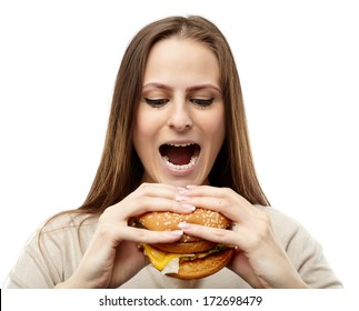 Young Caucasian Woman Preparing To Bite A Big Burger, Isolated On White Background