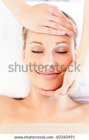 Similar – Young woman receiving a head massage in a spa center